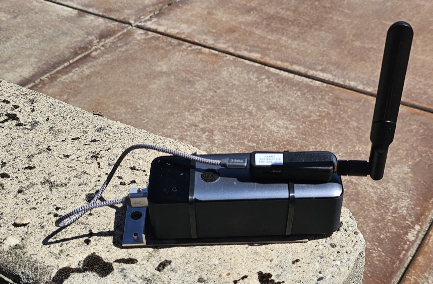 BlueMark DroneScout DS100 Remote ID bridge connected to an Anker USB power bank